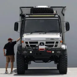 Rich standing next to the arksen overland unimog